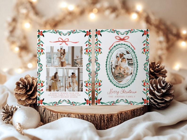 May include: Christmas card with family photos, featuring a watercolor design of green leaves, red berries, and a red bow. The card includes the text "Merry Christmas" and "Warmest wishes from our growing family to yours for a happy holiday season."