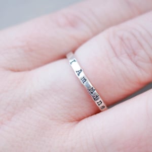 Sterling Silver Stacking Ring handstamped with I Am Mine on hand