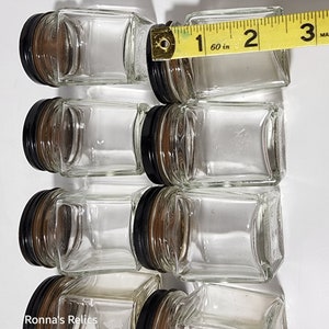 8- glass jars with black metal lids