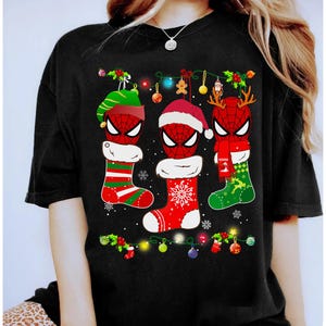 May include: A white ceramic mug with a black handle and the text "But First, Coffee" in a bold, black font. The mug is set against a neutral background, highlighting its simple design.