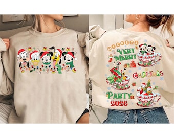 May include: Beige sweatshirt featuring a festive Christmas design with Disney characters. The front displays Mickey, Donald, Goofy, Pluto, and another character, all wearing Santa hats and scarves. The back says "Mickey's Very Merry Christmas Party 2026".