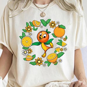 Camiseta divertida de pájaro naranja, camiseta de pájaro de Disney, Festival de flores y jardines de Epcot, camiseta familiar a juego del Festival de flores y jardines de Disneyland 2026