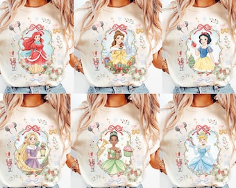 Coquette Disney Princess Castle Christmas T-shirt, Princess Christmas Tee, Belle Ariel Snow White Rapunzel Tiana Moana Cinderella Xmas Shirt