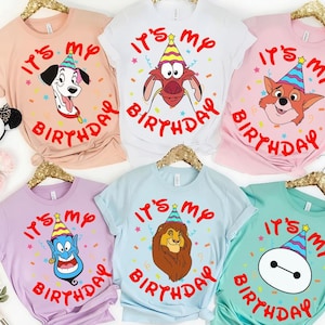 May include: Six short-sleeved crew neck t-shirts in peach, white, pink, lavender, light blue, and mint green. Each shirt features a cartoon character wearing a colorful party hat and the red text "IT'S MY BIRTHDAY" surrounded by confetti.