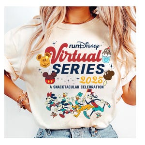 May include: Cream-colored t-shirt featuring the text "runDisney Virtual Series 2025" in red and blue, with cartoon character graphics. The shirt also includes the phrase "A Snacktacular Celebration".