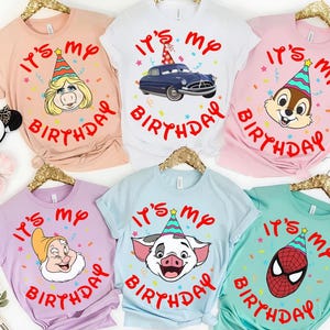 May include: Six short-sleeved t-shirts in peach, white, pink, lavender, light blue, and teal. Each shirt features the red text "IT'S MY BIRTHDAY" surrounding a cartoon character wearing a colorful party hat, including Miss Piggy, a car, Chip, Dopey, Pua, and Spider-Man.