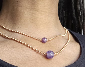 Collares sencillos de cadena con bolas de cristal intercambiables, de varias longitudes.