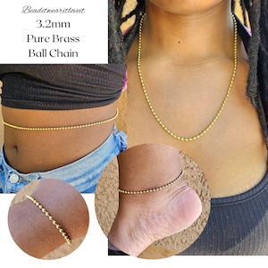 May include: A gold 3.2mm pure brass ball chain necklace, bracelet, and anklet. The chain is shown being worn around the waist, wrist, and ankle.