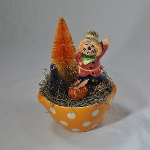 Handcrafted Halloween Miniature Vignette with vintage scarecrow shaker, pumpkin, and bottle brush trees
