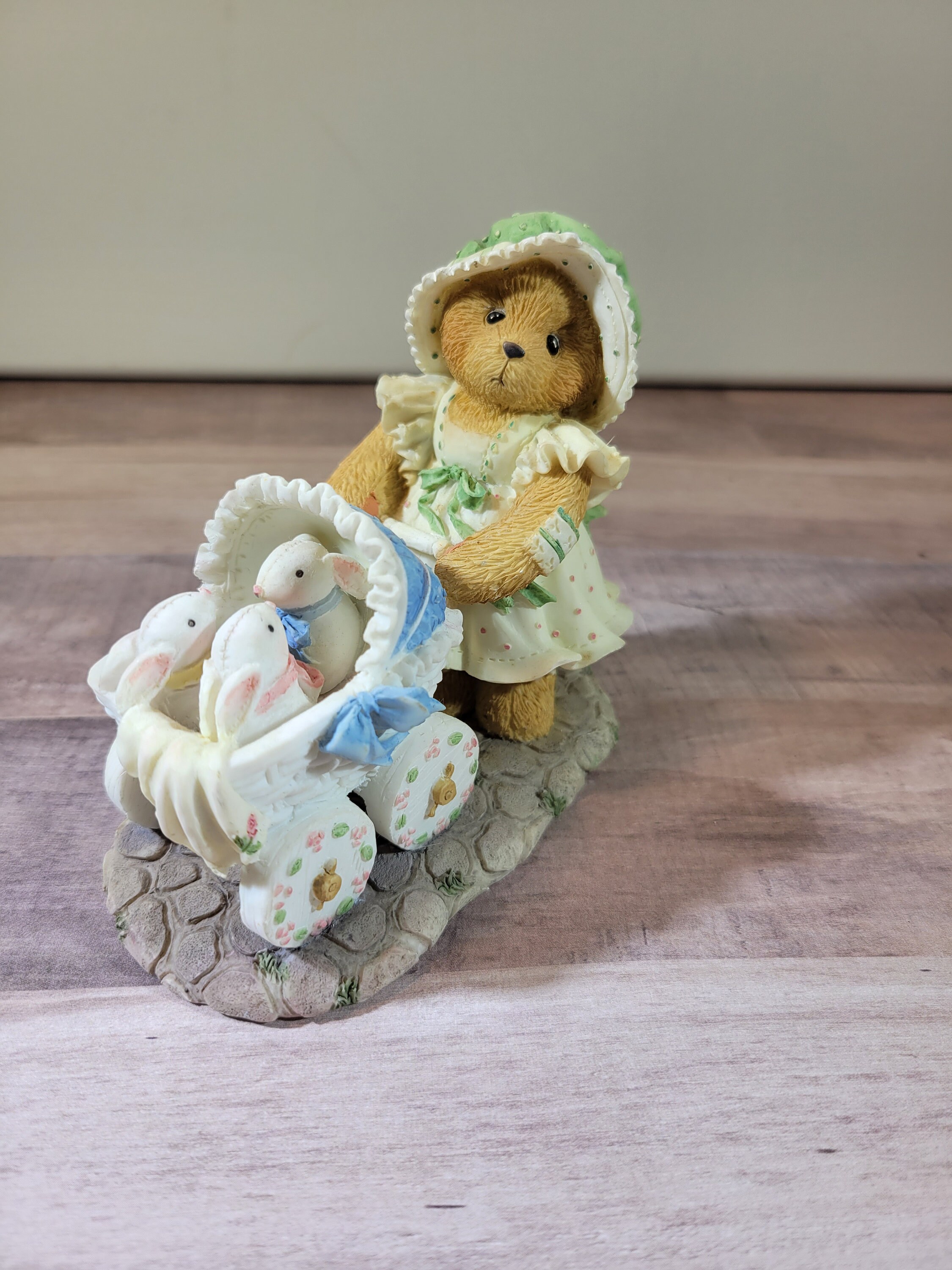 Jessica, a Mother Bear With Baby Rabbits in a Stroller