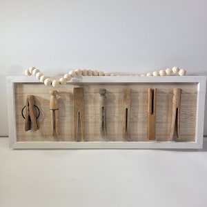 Horizontal framed collection of vintage wooden clothespins, laundry room decor, wooden decor, beaded hanger