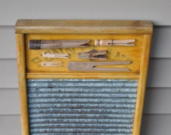 Washboard with antique and vintage clothespins, laundry room decor, metal and wood washboard