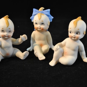 Trio of Baby figurines, two boys and a girl, ceramic, vintage