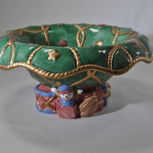 Fitz and Floyd Christmas dish, green, red, and gold with stars and toys, ceramic