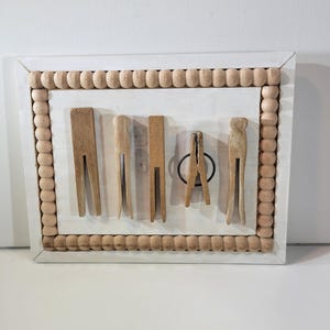 Small framed collection of vintage wooden clothespins, laundry room decor, wooden decor