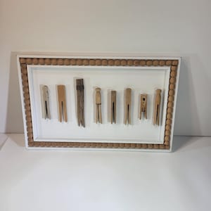 Framed collection of antique and vintage wooden clothespins, laundry room decor, wooden decor