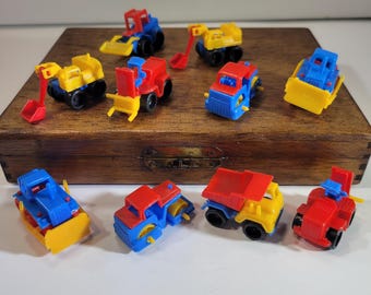 Set of 10 miniature plastic construction toys, 1980's trucks, assortment