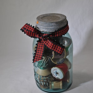 Blue Ball Mason jar with zinc lid filled with vintage wooden thread spools, glass ware,  vintage