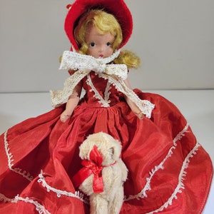 Sweet Nancy Ann doll, painted eyes, movable head, arms and legs, collectible, red dress with off-white lace trim