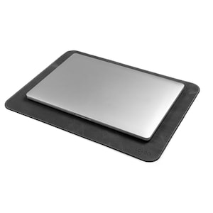 May include: A gray leather laptop desk pad with the word "LONDO" embossed on the bottom right corner.