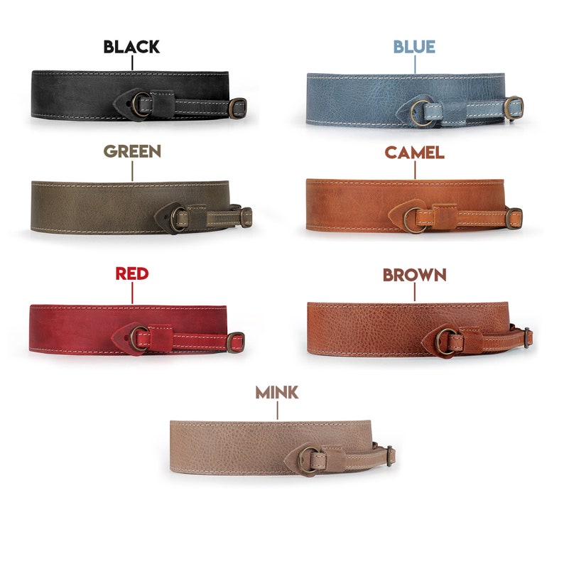 May include: Six leather camera straps in different colours: black, blue, green, camel, red, and mink. Each strap has a metal buckle and a leather loop.