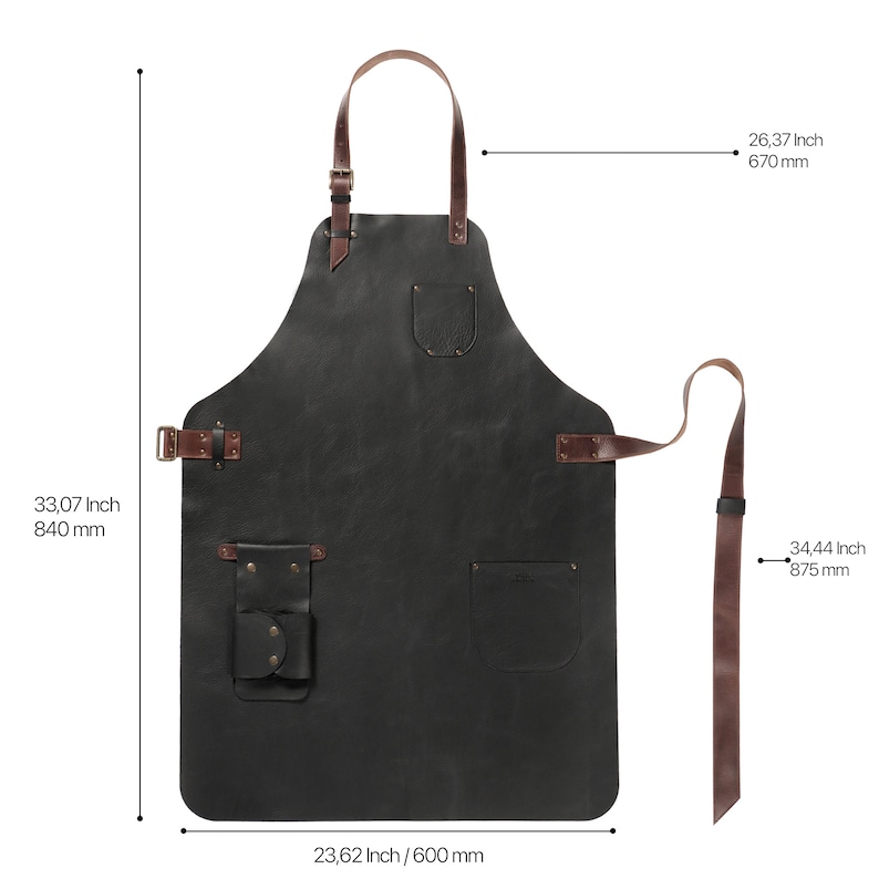 May include: Black leather apron with brown leather straps and buckles. It has two pockets and a tool loop. The apron measures 840 mm tall, 600 mm wide, and has a 875 mm strap.