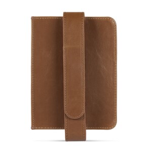May include: A brown leather case with a strap for holding a tablet or e-reader.