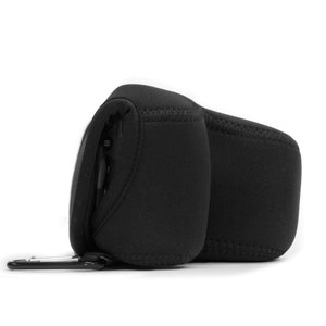 May include: Black camera case with a zipper closure and a carabiner clip. The case is made of a soft, padded material and has a textured surface.