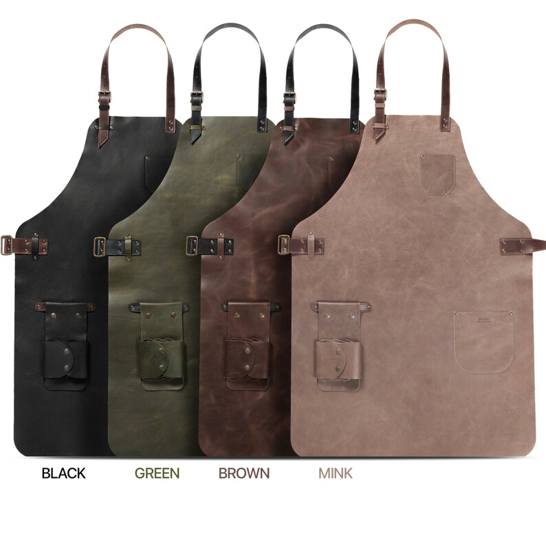 May include: Four leather aprons in different colours: black, green, brown, and mink. Each apron has adjustable straps, a large pocket, and a smaller tool pocket.