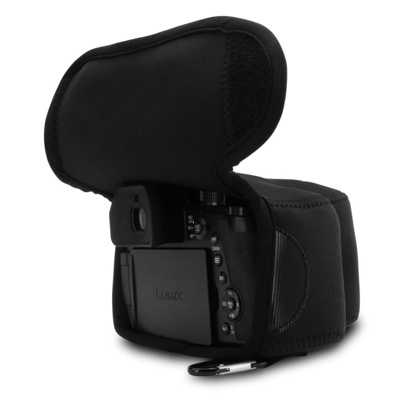 May include: Black camera case with a zipper and a strap. The case is made of neoprene and has a soft, padded interior to protect your camera. The case is designed to fit a compact camera with a lens.