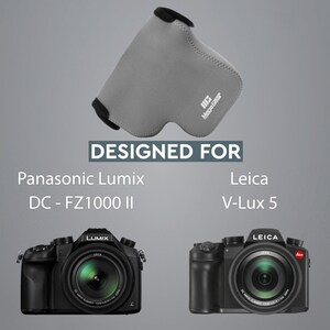 May include: A grey camera lens protector with the text "Mega Gear" printed on it. The protector is designed for the Panasonic Lumix DC-FZ1000 II and Leica V-Lux 5 cameras.
