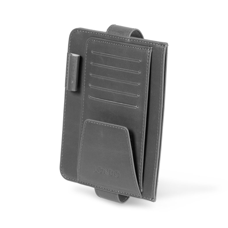 May include: Gray leather car organizer with multiple card slots, a large pocket, and a pen holder. The organizer has a strap to attach to a car's headrest. The brand name "LONSD" is printed on the front.