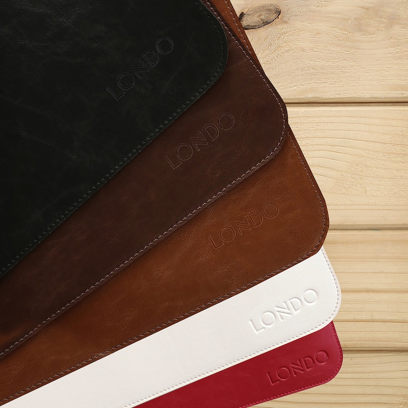 May include: Five leather mouse pads in different colors: black, brown, tan, white, and red. Each pad has the word "LONDO" embossed in the center.