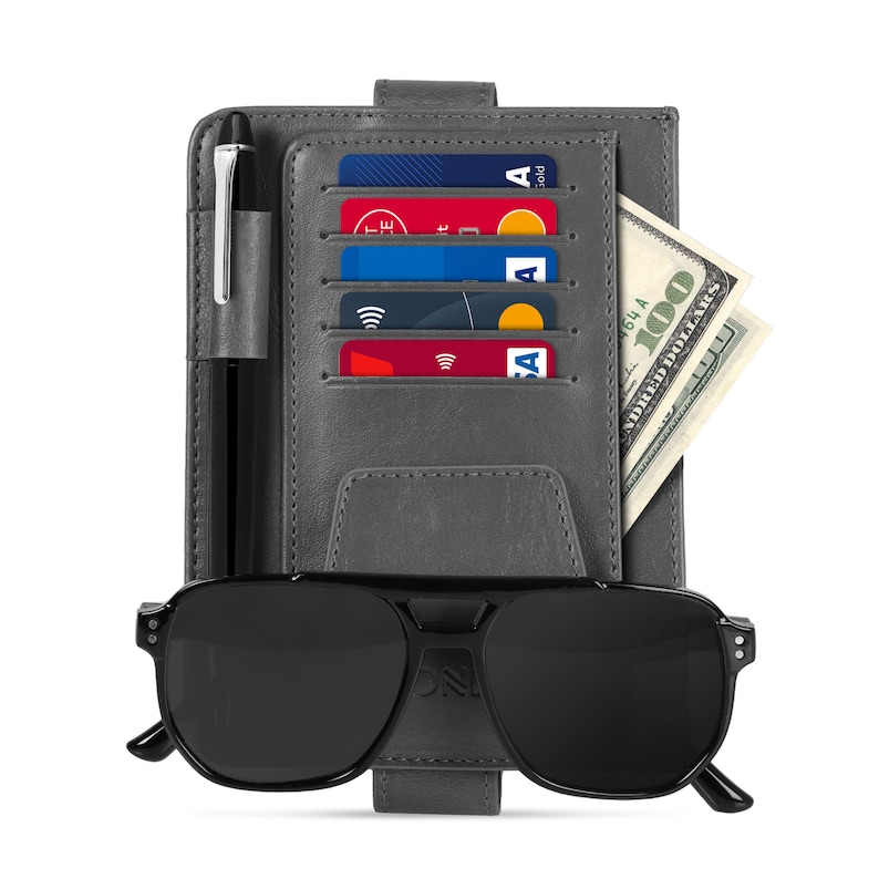 May include: A gray leather wallet with a pen, credit cards, and cash. The wallet has a built-in sunglasses holder and a black pair of sunglasses.