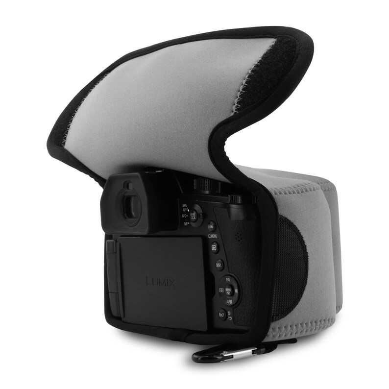May include: A grey and black camera case with a zipper closure and a carabiner clip. The case is made of neoprene and has a soft, padded interior to protect your camera.