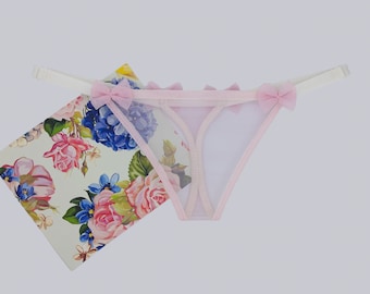 Transparent women's thong panties made of soft tulle mesh in pink color. All sizes available XXS, XS, S, M, L, XL, 2X, 3X, 4X, 5X