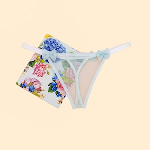 Transparent women&#39;s thong panties made of soft tulle mesh in light blue color. All sizes available XXS, XS, S, M, L, XL, 2X, 3X, 4X, 5X