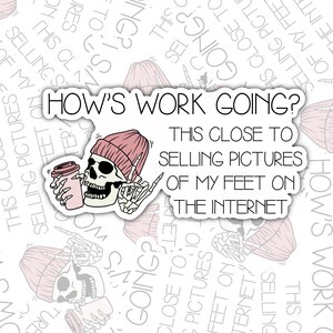 May include: A sticker with a cartoon skeleton wearing a pink beanie and holding a coffee cup. The text on the sticker reads "How's work going? This close to selling pictures of my feet on the internet."