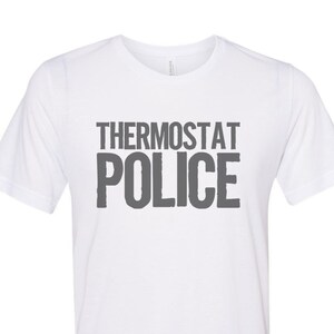 May include: White t-shirt with the text "Thermostat Police" printed in grey.
