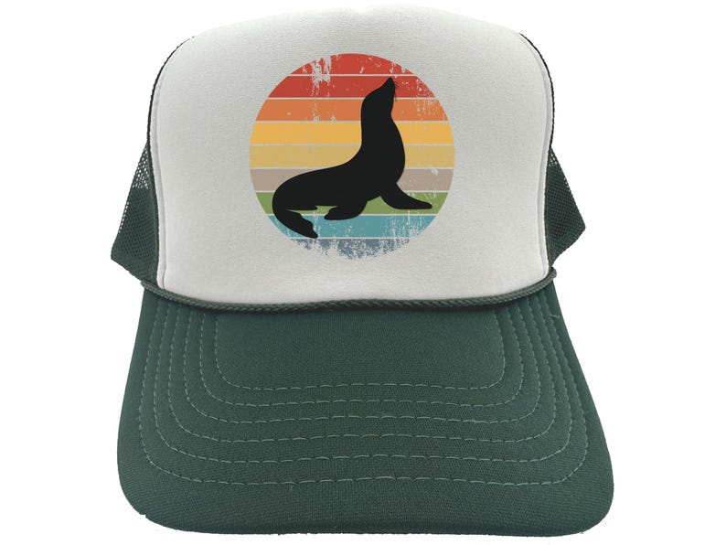 May include: A white and green trucker hat with a retro-style graphic of a seal silhouette in front of a rainbow sunset.