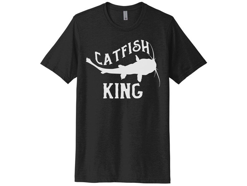 May include: Black t-shirt with a white silhouette of a catfish and the text "Catfish King".