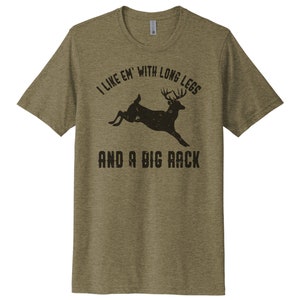May include: A green t-shirt with a black deer silhouette and the text "I like 'em with long legs and a big rack".