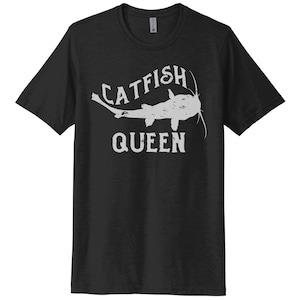 May include: Black t-shirt with a white graphic of a catfish and the text "Catfish Queen".