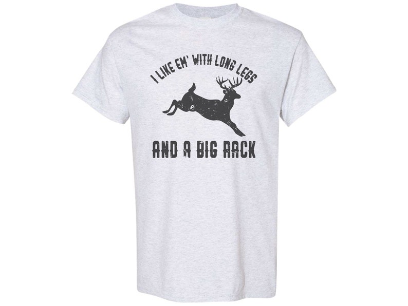 May include: A gray t-shirt with a black silhouette of a deer with large antlers and the text "I like 'em with long legs and a big rack".