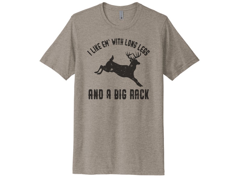 May include: A heather grey t-shirt with a black silhouette of a deer with large antlers and the text "I like 'em with long legs and a big rack".
