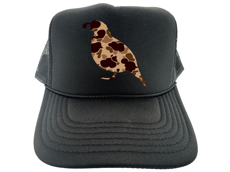 May include: Black trucker hat with a camouflage quail design. The hat has a mesh back and a black brim.