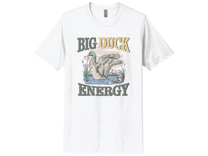 May include: White t-shirt with a cartoon duck illustration and the text "BIG DUCK ENERGY" in yellow and green.