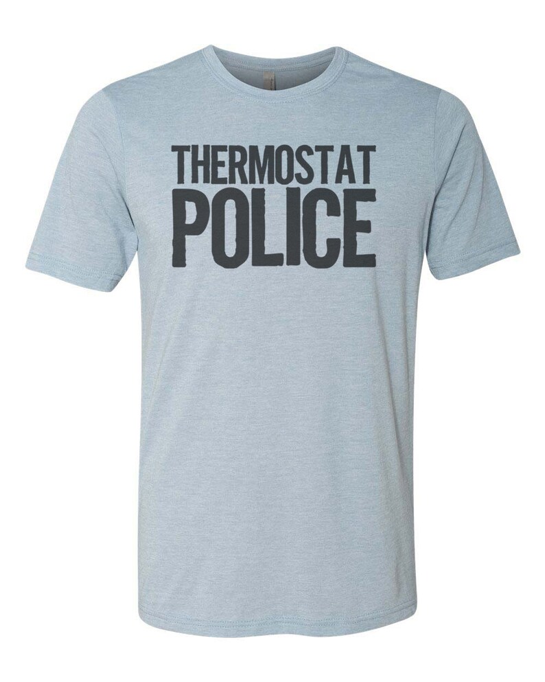 May include: A light blue t-shirt with the text "Thermostat Police" printed in black.