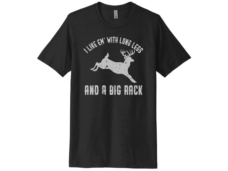 May include: Black t-shirt with a white graphic of a deer with the text "I like 'em with long legs and a big rack".