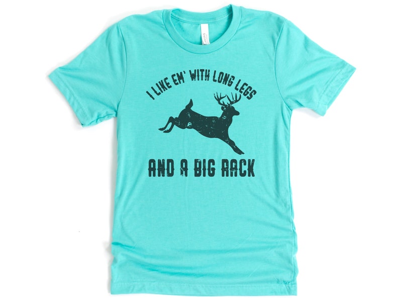 May include: Teal blue t-shirt with a black silhouette of a deer with the text "I like 'em with long legs and a big rack".